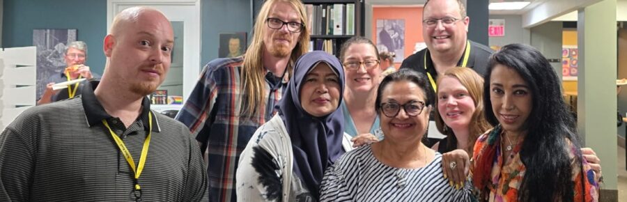 Group photo of happy Action Read members at our Annual General Meeting June 2026.