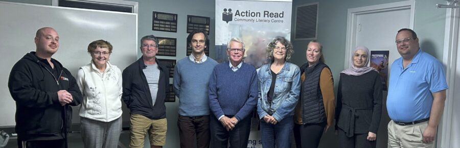The nine members of Action Read's 2026-2027 board of directors, smiling after their board meeting.